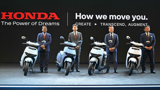 (R-L) Hiroya Ueda, the chief engineer of Monozukuri supervisory unit motorcycle and power products operations Honda Motor Co., Daiki Mihara, the vice president of the head of motorcycle and power products electrification business development unit, electrification business development operations of Honda Motor Co., Tsutsumu Otani, the managing director, president and chief executive officer of Honda motorcycle and scooter India and Yogesh Mathur, the director sales and marketing Honda motorcycle and scooter India, pose during the launch of the Honda Activa-e and QC1 electric scooters, in Bengaluru on November 27, 2024.