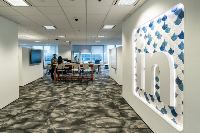 Signage at the LinkedIn Corp. offices in Singapore, on Thursday, Oct. 17, 2024. Acquired by Microsoft in 2016 for $26 billion, LinkedIn has pushed for more engaging content for years, luring influencer-types while encouraging people to post more often. Photographer: Bryan van der Beek/Bloomberg via Getty Images