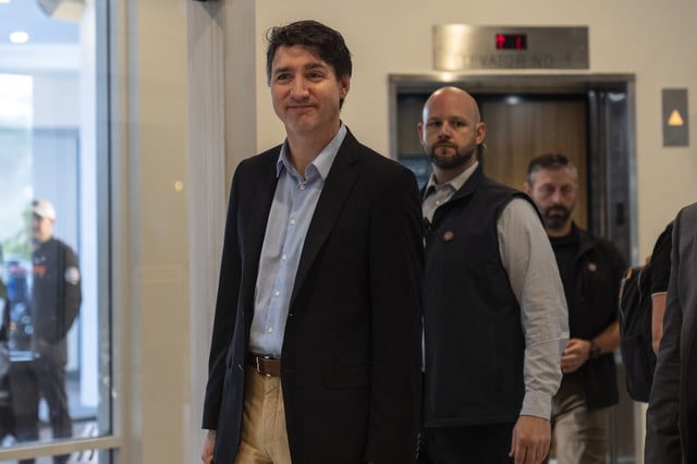 Canada Prime Minister Justin Trudeau walks through the lobby of the Delta Hotel by Marriott, Saturday, Nov. 30, 2024, in West Palm Beach, Fla. 