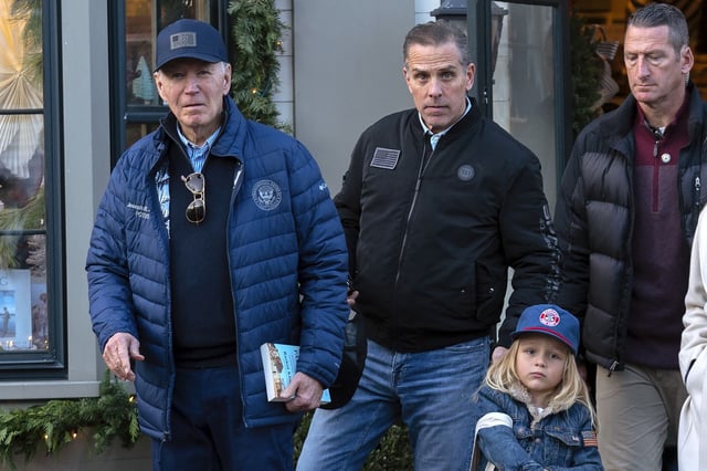 President Joe Biden and his son Hunter Biden walk in downtown Nantucket Massachusetts, on November 29, 2024.