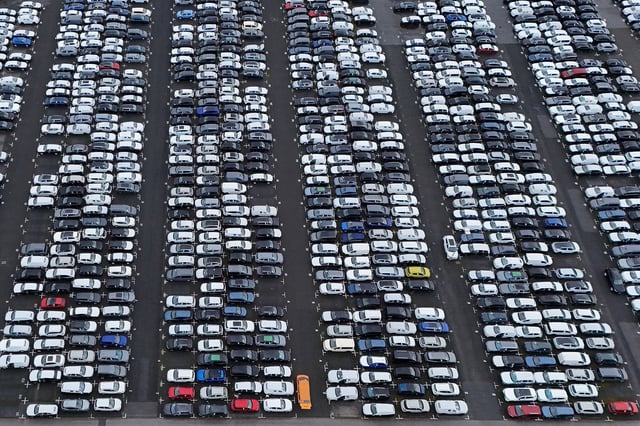 Aerial view shows new cars of various brands that are parked ready for sale at a car logistics terminal in Essen, Germany.