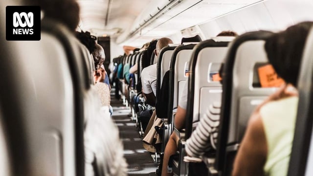 The aisle of a plane's cabin.