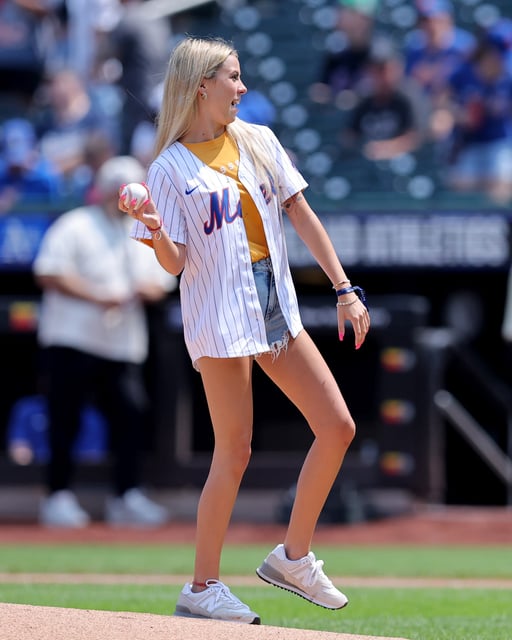 Viral internet star Haliey Welch throws out a ceremonial first pitch Aug. 15 before a game between the New York Mets and the Oakland Athletics at Citi Field.