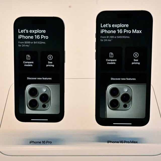 Apple's iPhone 16 Pro and 16 Pro Max are pictured at a store in Los Angeles, California on September 20, 2024. An upcoming operating system update is set to deliver a number of new artificial intelligence-based features to the phones.