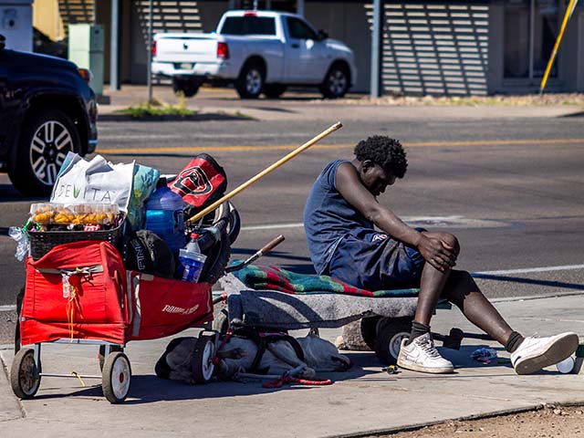 A homeless man is slumped over on a city bench in Phoenix on April 16, 2024 in Phoenix, Arizona. The city has been hit hard by the fentanyl epidemic, the homeless especially. More than 14,000 Arizonans are homeless on a given night, a population less than half the size of California's on a per capita basis but still one of the nation's largest, according to federal statistics, which are known to understate the problem.(Gina Ferazzi / Los Angeles Times via Getty Images)
