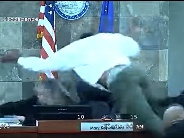 FILE - In this image from video provided by the Clark County District Court, a defendant identified by court officials and records as Deobra Redden is seen launching over the desk of Judge Mary Kay Holthus during his sentencing in a felony battery case on Wednesday, Jan. 3, 2024 in Las Vegas. (Clark County District Court via AP, File)