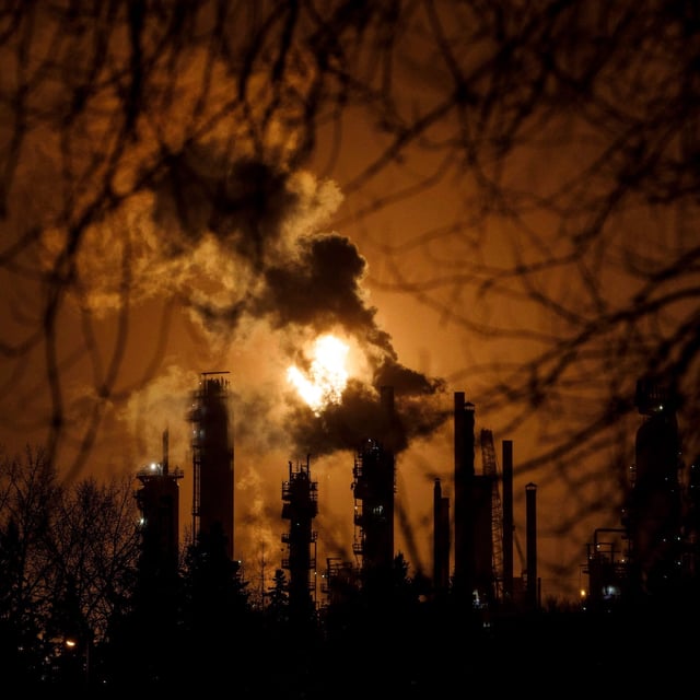 A flare stack lights the sky along refinery row in Edmonton on December 28, 2018. THE CANADIAN PRESS/Jason Franson