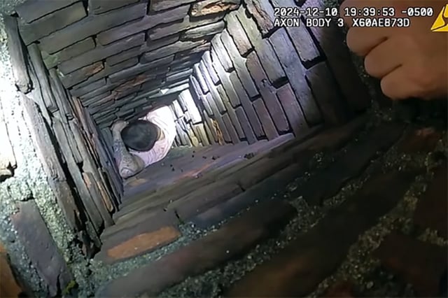 A man fleeing police became trapped in a chimney, in Fall River, Mass., on Tuesday.