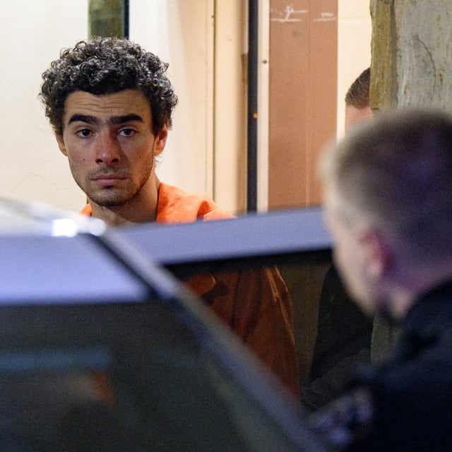 Luigi Mangione is led from the Blair County Courthouse after an extradition hearing December 10, 2024 in Hollidaysburg, Pennsylvania. Pictures of Mangione were shown on the big screen during a concert in Boston.
