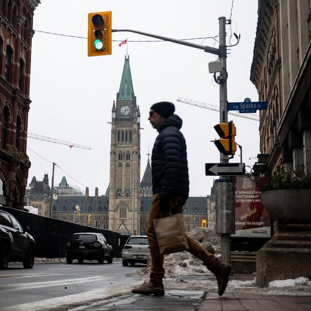 A person walks near Parliament Hill in Ottawa, Monday, Dec. 16, 2024. THE CANADIAN PRESS/Spencer Colby
