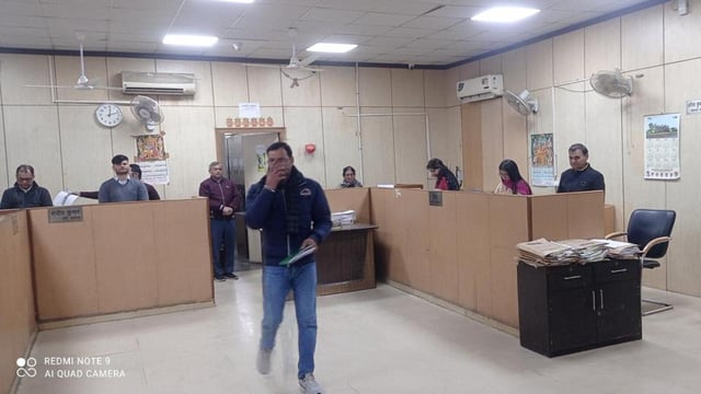 The entire staff, following the CEO’s directions, attended to the visitors while standing next to their chairs for 20 minutes as a punishment for negligence. (HT Photos)