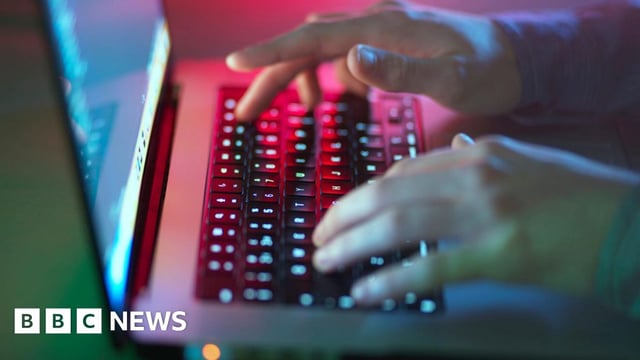 Anonymous shot of a person's hand typing in a keyboard.