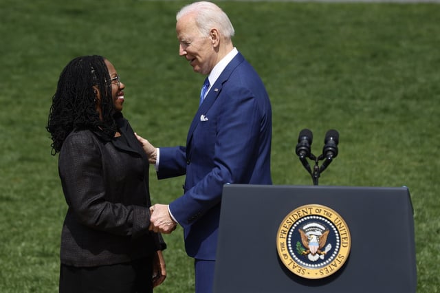 Joe Biden shakes hands with Judge Ketanji Brown Jackson during an event celebrating her confirmation to the U.S. Supreme Court at he White House on April 8, 2022.
