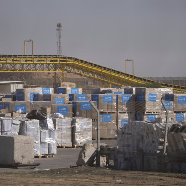 Humanitarian aid waiting to be picked up on the Palestinian side of the Kerem Shalom aid crossing in the Gaza Strip, Thursday, Dec. 19, 2024. Once aid arrives at the Gazan side of the checkpoint, it is the responsibility of the Palestinians and international aid organizations to pick up the aid and distribute it to the population, Israel says.