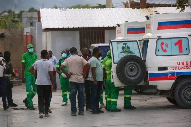 Medics inspect an ambulance of wounded people, shot by armed gangs at the General Hospital, in Port-au-Prince, Haiti, on Tuesday, December 24.