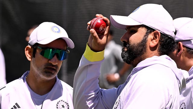 Indian coach Gautam Gambhir (L) and captain Rohit Sharma (R) chat in the nets at the Melbourne Cricket Ground (MCG) in Melbourne --