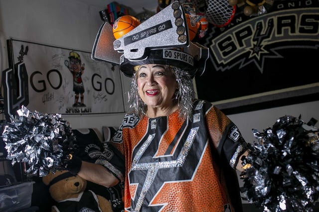Sovia Lauriano is pictured at her San Antonio home in 2022. Known as the &#34;Spurs Lady,&#34; Lauriano was popular among fellow San Antonio Spurs fans for her enthusiastic support of the team. She died Saturday, according to reports.