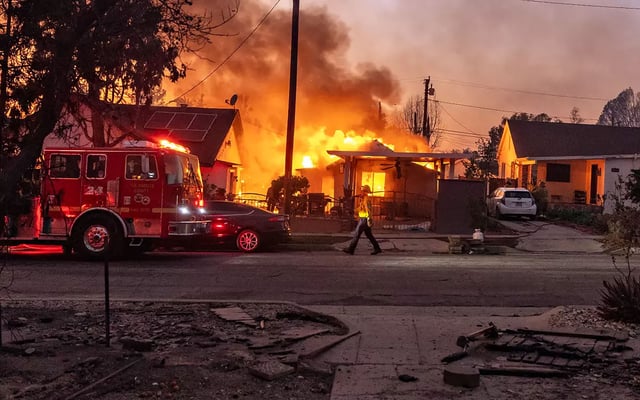 Flames from the Eaton fire consume a home in Altadena, Calif., on Jan. 8. (Jason Armond/Los Angeles Times/TNS)