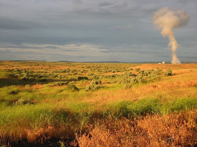 Hanford Nuclear Reservation with Northwest Energy's nuclear reactor letting off steam in the background. (Photo by Tobin, via Flickr, Creative Commons)