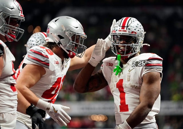 Ohio State running back Quinshon Judkins (1) celebrates after scoring a touchdown against Notre Dame.