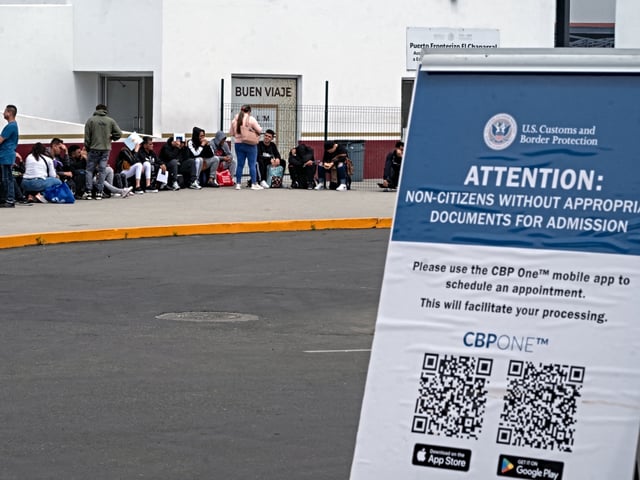 Asylum seekers queue at the El Chaparral crossing port to attend their appointment with US authorities at the US-Mexico border in Tijuana, Baja California State, Mexico, on June 5, 2024. President Joe Biden said Tuesday he had ordered sweeping new migrant curbs to "gain control" of the US-Mexico border, making a dramatic bid to neutralize one of his political weak spots in his reelection battle against Donald Trump. (Photo by Guillermo Arias / AFP)