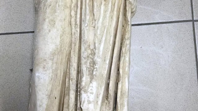 This undated handout photo provided by the Greek Police and released on Wednesday, Jan. 22, 2025 shows a marble statue of a woman believed to be more than 2,000 years old which was found abandoned in a garbage bag in the northern city of Thessaloniki, Greece. (Greek Police via AP)