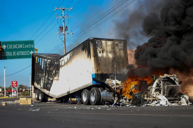 A truck burns on a street in Culiacan, Sinaloa state, Mexico, after a cartel operation on Jan. 5, 2023.