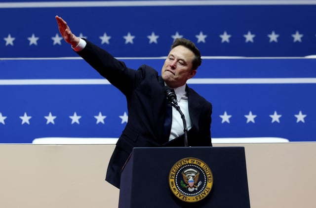 Elon Musk makes a gesture at the podium inside the Capital One arena on the inauguration day of U.S. President Donald Trump's second term.