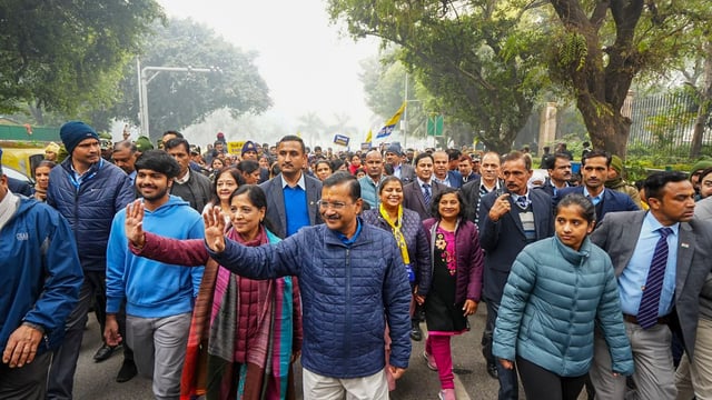 Aam Aadmi Party (AAP) National Convener Arvind Kejriwal on his way to file nomination for the upcoming Delhi Assembly elections, in New Delhi. 
