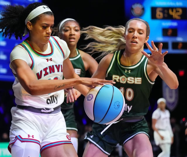 Rae Burrell (12) of the Vinyl battles for possession with Lexie Hull (10) and Angel Reese (5) of the Rose during the first half of the Unrivaled women’s professional 3v3 basketball league at Wayfair Arena.