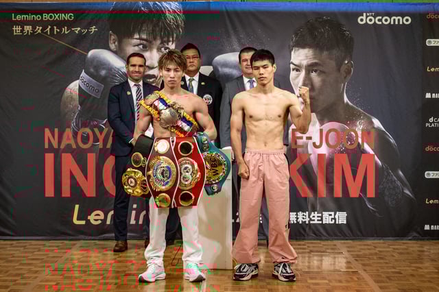 South Korea's Kim Ye-joon (right) and Japan's Naoya Inoue (left) pose during the official weigh-in ahead of their world super-bantamweight title boxing bout in Yokohama on Jan. 23, 2025.