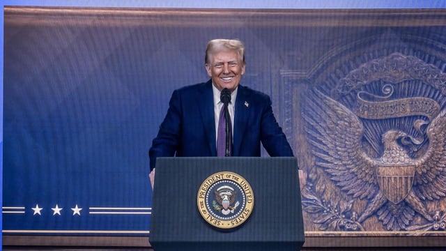 US President Donald Trump is seen on a large screen during his address by video conference at the World Economic Forum (WEF) annual meeting in Davos.