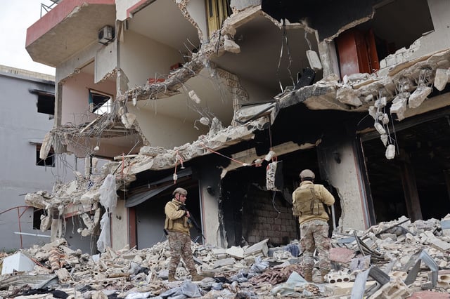 Lebanese soldiers inspect a residential area that was devastated during fighting between Israel and Hezbollah, in the southern coastal town of Naqura, on Wednesday.