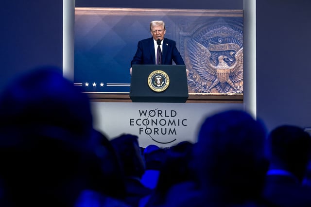 US President Donald Trump is seen on a giant screen during his address by video conference at the World Economic Forum annual meeting in Davos, Switzerland, on Thursday.