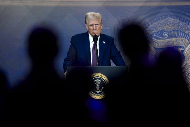 Attendees listen to a virtual speech delivered by U.S. president Donald Trump, at the Annual Meeting of World Economic Forum in Davos, Switzerland, Thursday, Jan. 23, 2025. 