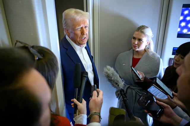President Donald Trump, alongside White House press secretary Karoline Leavitt, speaks with the reporters aboard Air Force One after departing Las Vegas on January 25, 2025.