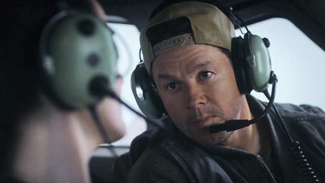 This image released by Lionsgate shows Michelle Dockery, left, and Mark Wahlberg in a scene from "Flight Risk." (Lionsgate via AP)