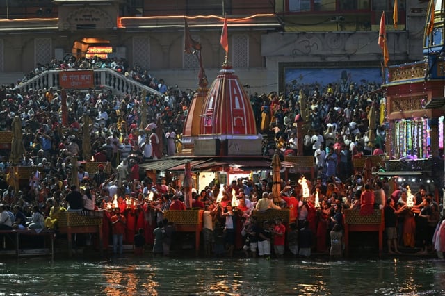 Hindu devotees gather during evening prayers at Har Ki Pauri on the banks of the Ganges River in Haridwar, Uttarakhand. State officials began implementing a new common civil code that Muslims say discriminates against them
