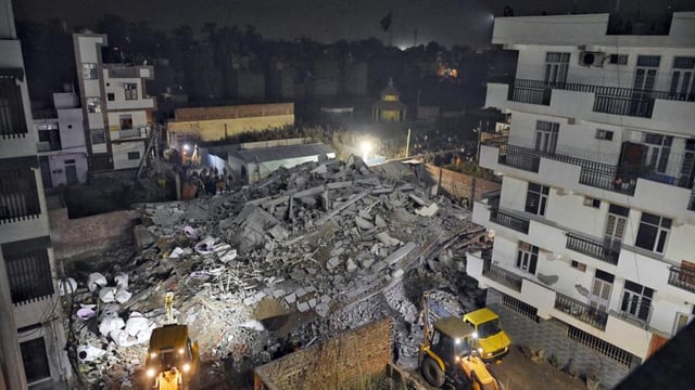 Rescue operations underway at the site late on Monday night. (ANI)