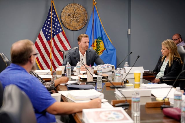 Oklahoma State Superintendent of Public Instruction Ryan Walters, center, has praised the proposed rule change that would require families to report their immigration status to schools.