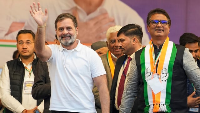 Congress leader Rahul Gandhi with party candidate Anil Chaudhary during a rally for the upcoming Delhi Assembly elections, at Patparganj.