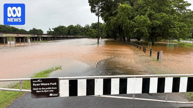 Muddy floodwaters engulf a park