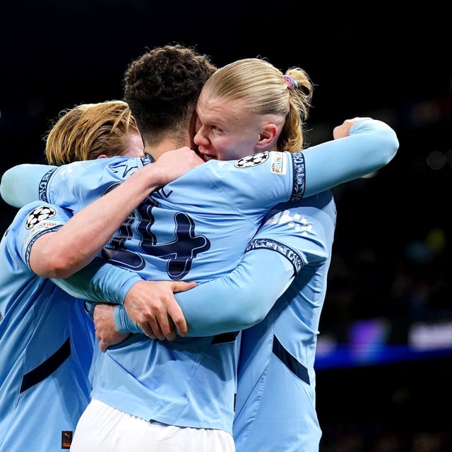 Manchester City's Erling Haaland, right, celebrates with teammate Josko Gvardiol whose cross led to an own goal during the Champions League opening phase soccer match between Manchester City and Club Brugge at the Etihad Stadium in Manchester, Wednesday, Jan. 29, 2025. (Mike Egerton/PA via AP)