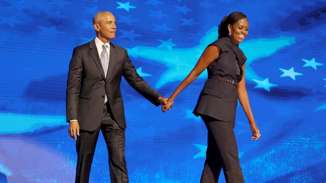 DNC CHICAGO, IL AUGUST 20, 2024  Former President Barack Obama and former first lady Michelle Obama on stage during the Democratic National Convention Tuesday, Aug. 20, 2024, in Chicago. (Robert Gauthier/Los Angeles Times via Getty Images)