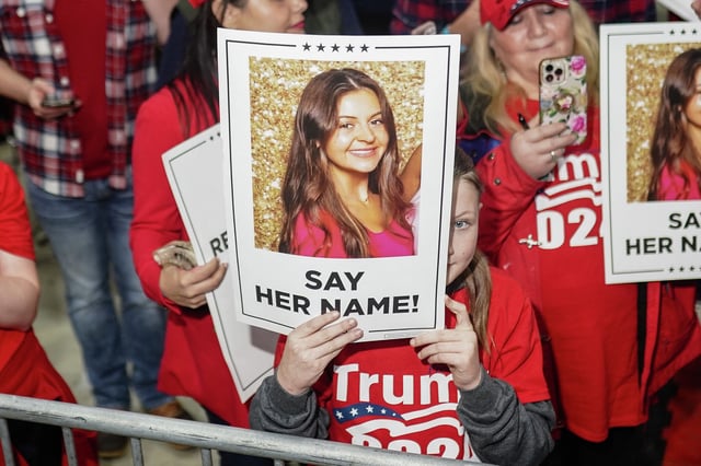 Supporters of Donald Trump hold images of Laken Riley before he speaks at a rally March 9, 2024, in Georgia.