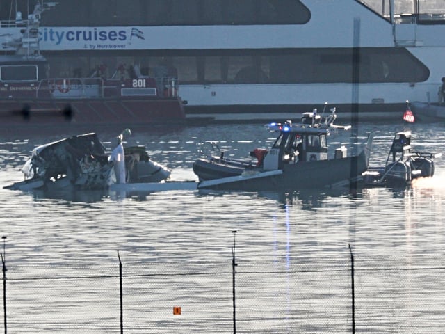 ARLINGTON, VIRGINIA - JANUARY 30:  Emergency response units search the crash site of the American Airlines plane on the Potomac River after the plane crashed on approach to Reagan National Airport on January 30, 2025 in Arlington, Virginia. The American Airlines flight from Wichita, Kansas collided with a military helicopter while approaching Ronald Reagan National Airport. Dozens of people are feared to have died in the midair collision. (Photo by Win McNamee/Getty Images)