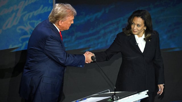 Kamala Harris (R) shakes hands with  Donald Trump (L) during a presidential debate at the National Constitution Center in Philadelphia, Pennsylvania, on September 10, 2024.