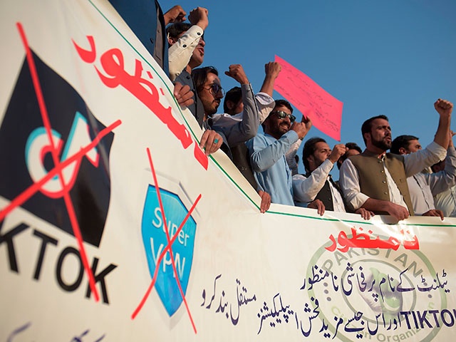 Activists of Pakistan Citizen Organisation shout slogans against the restore of TikTok services in the country, in Islamabad on October 20, 2020.    - Pakistan on October 19 said it would lift a recent ban on the video-sharing app TikTok after assurances that "immoral" content would be blocked. (Photo by Farooq NAEEM / AFP) (Photo by FAROOQ NAEEM/AFP via Getty Images)