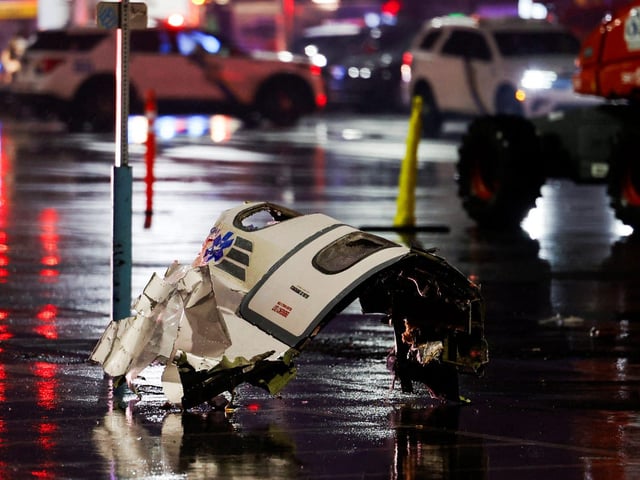 Debris of the fallen Learjet 55 Medevac plane lies on the ground at the site of the crash in Philadelphia, Pennsylvania.