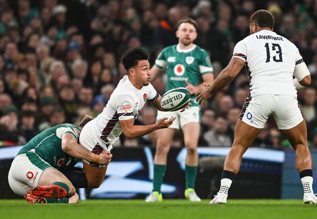 Marcus Smith is tackled by Garry Ringrose but gets the offload away to Ollie Lawrence